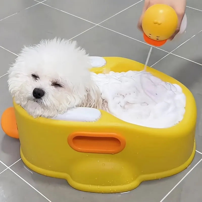 Blue duck-shaped PVC bathtub for washing small dogs and cats on a plain background.