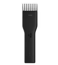 Black cordless men's electric hair clipper with adjustable slider comb and ceramic cutter head.