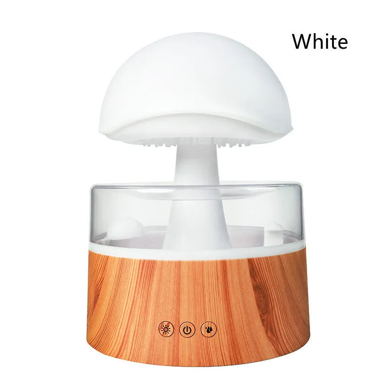 White Rain Cloud Humidifier showing raindrop effect, colour-changing light, and remote control on a table.