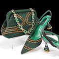 Women's pointed toe high heel shoes with matching bag, featuring rhinestone details and a wine glass heel.