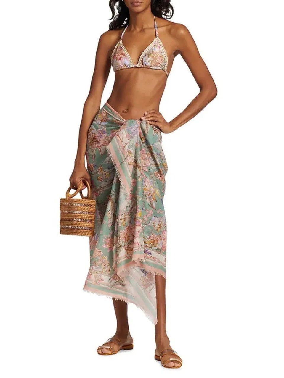Women's creamy-white floral pattern bikini swimsuit set with top, briefs, and skirt