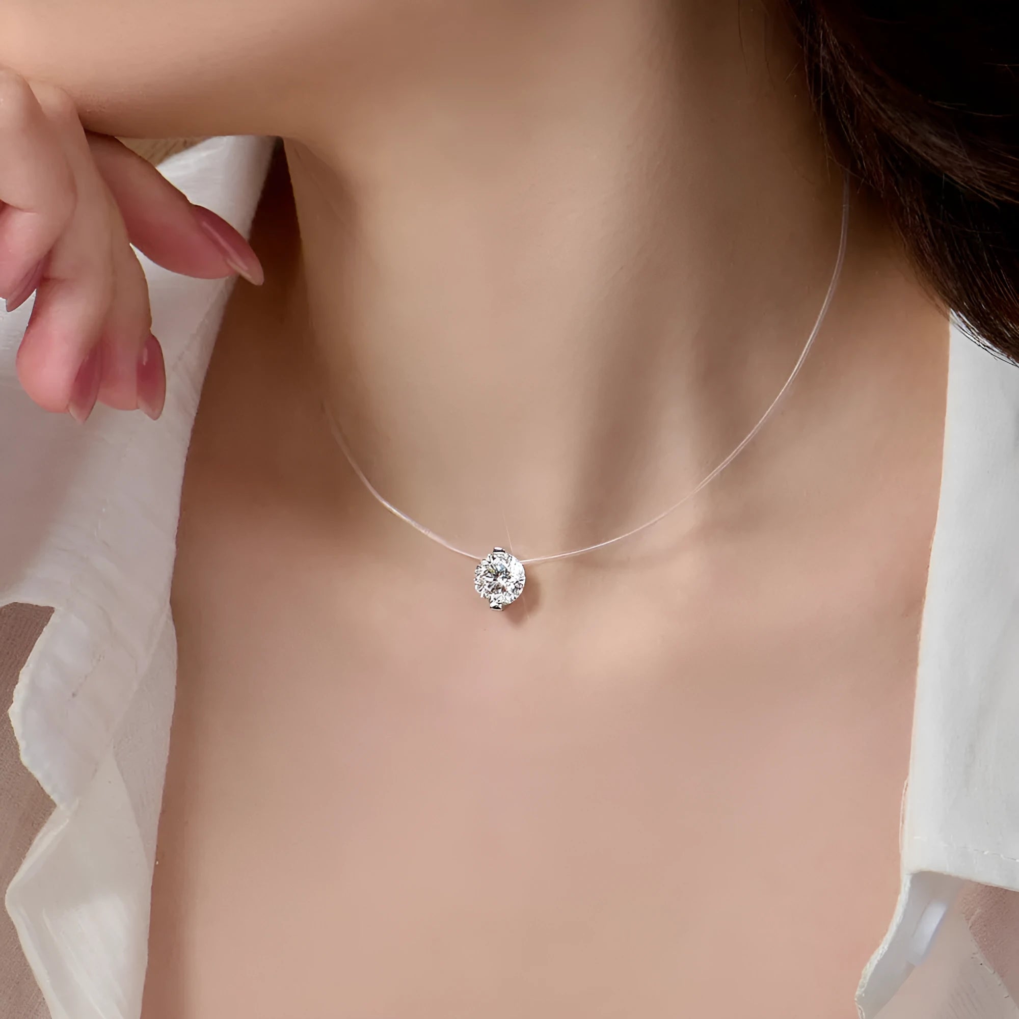 Women's sterling silver pendant necklace with moissanite stone on invisible fishing line chain