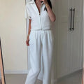Loose fit casual top with Damascus pattern in black, shown with short sleeves.