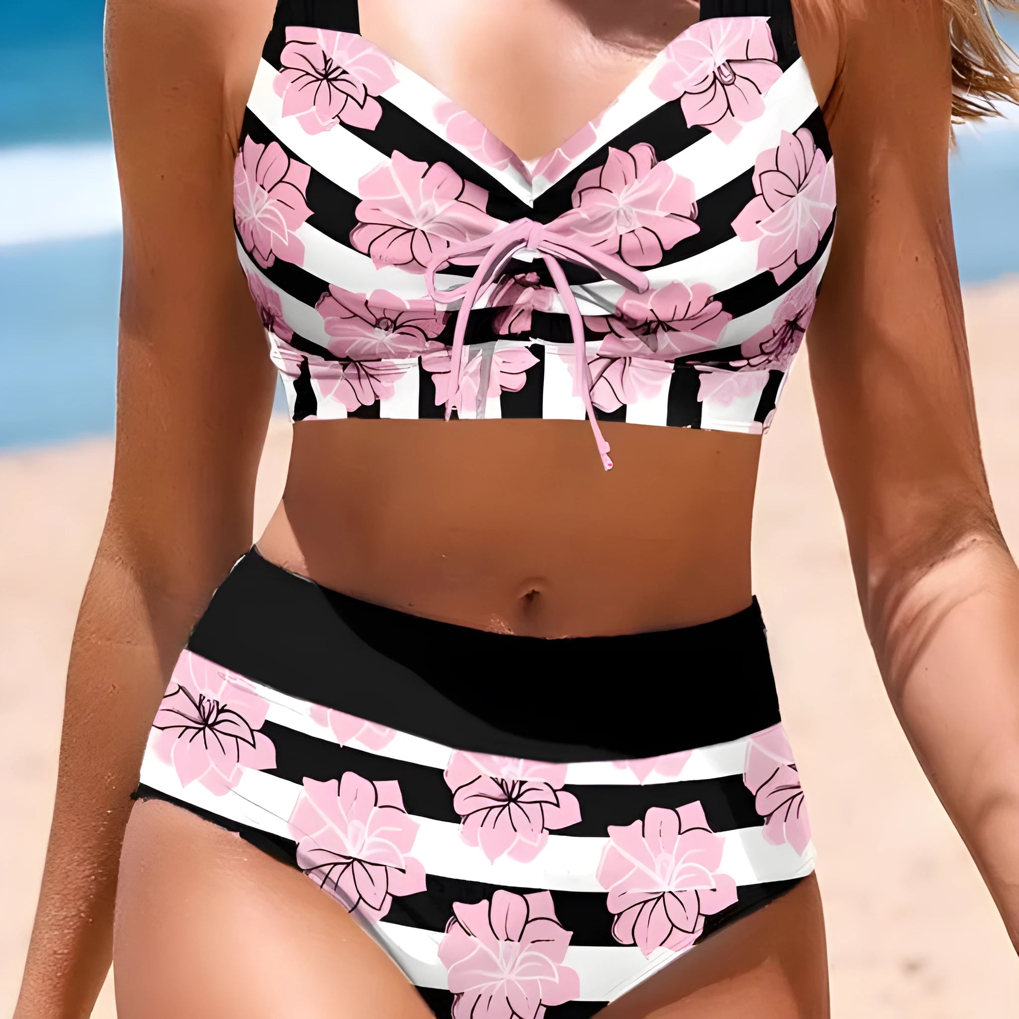 Black printed women's bikini with slimming belly panel and split-leg bottoms.