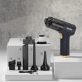 Black wireless car vacuum cleaner and inflator with multiple nozzle attachments