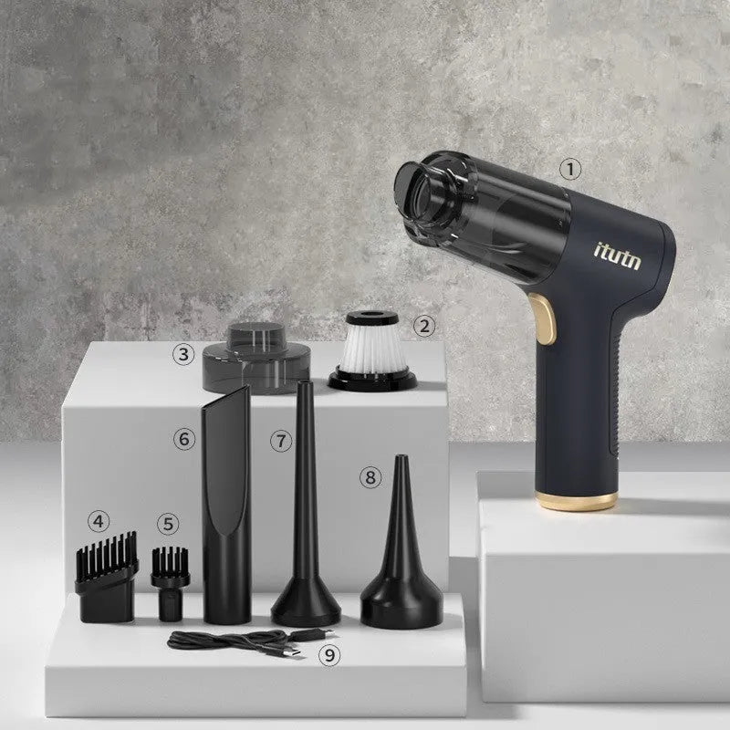 Black wireless car vacuum cleaner and inflator with multiple nozzle attachments