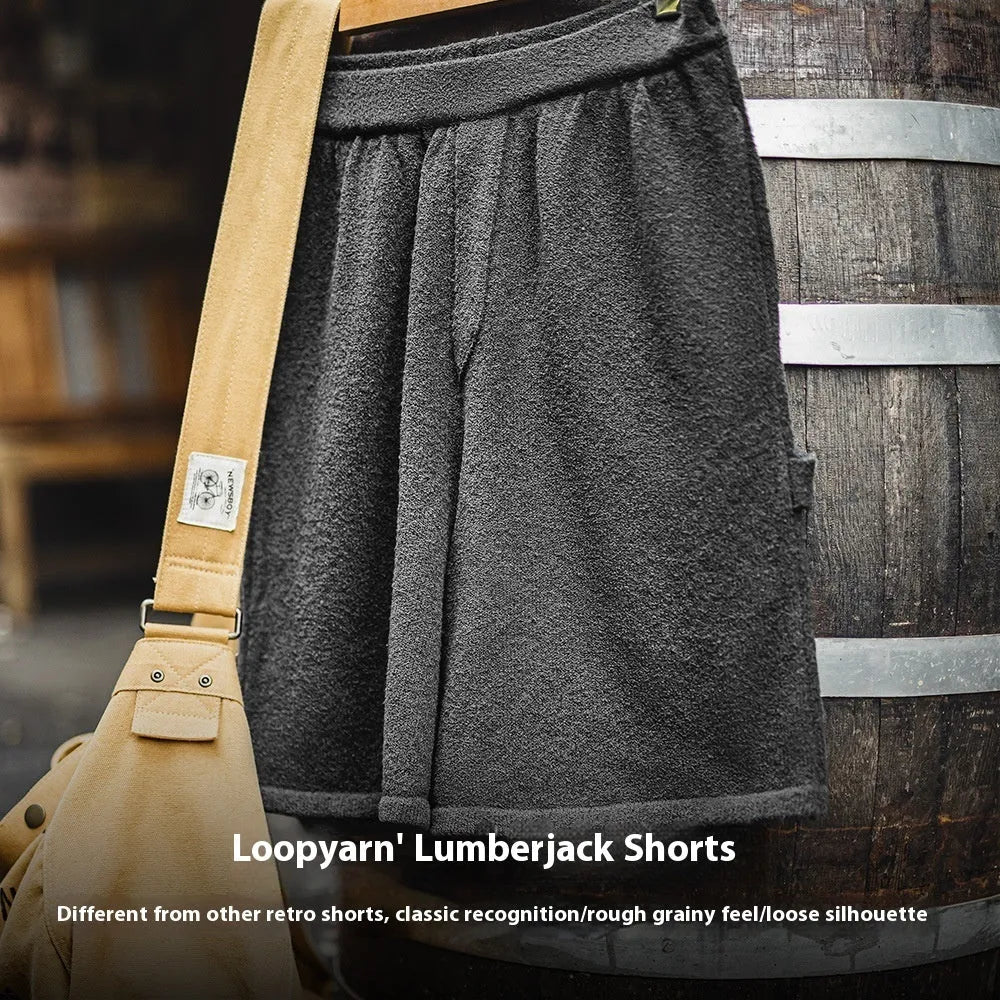 Cement grey polyester sports shorts with straight cut design and elastic waistband