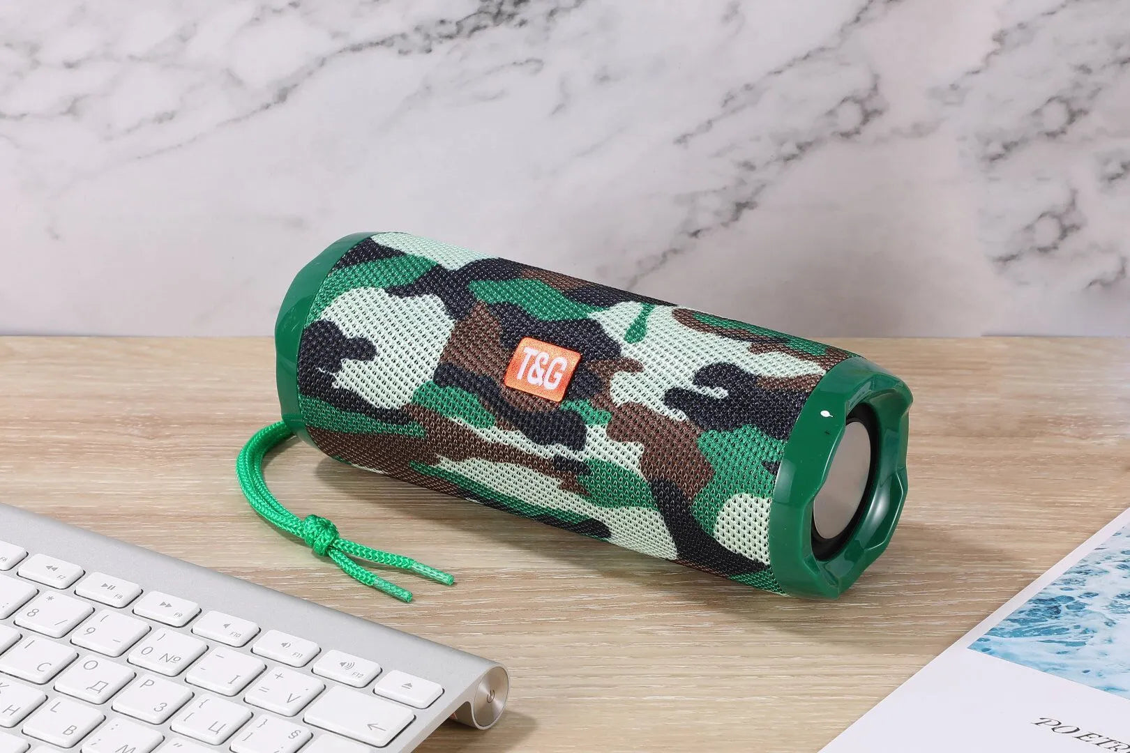 Fabric portable Bluetooth speaker with integrated card holder shown in multiple colour options.