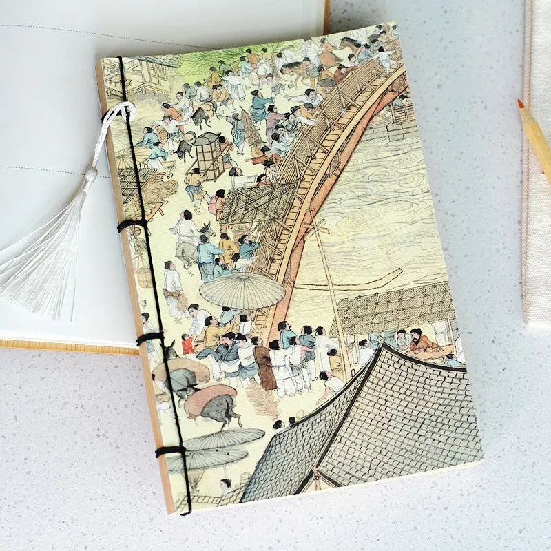 A5 antique wire-bound notebook with retro painting cover, thread binding, and black tassels.
