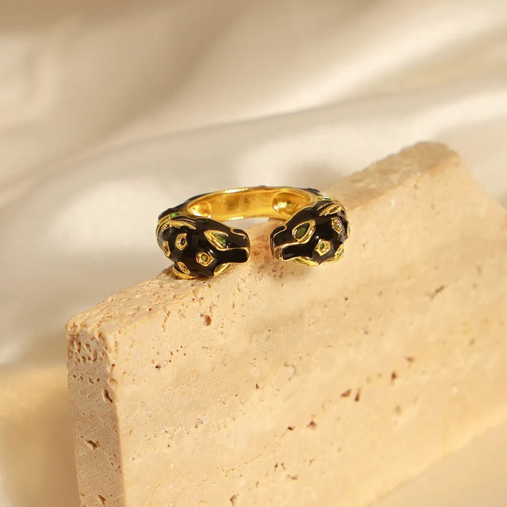 Women's black cheetah print copper ring with geometric open design in size 7