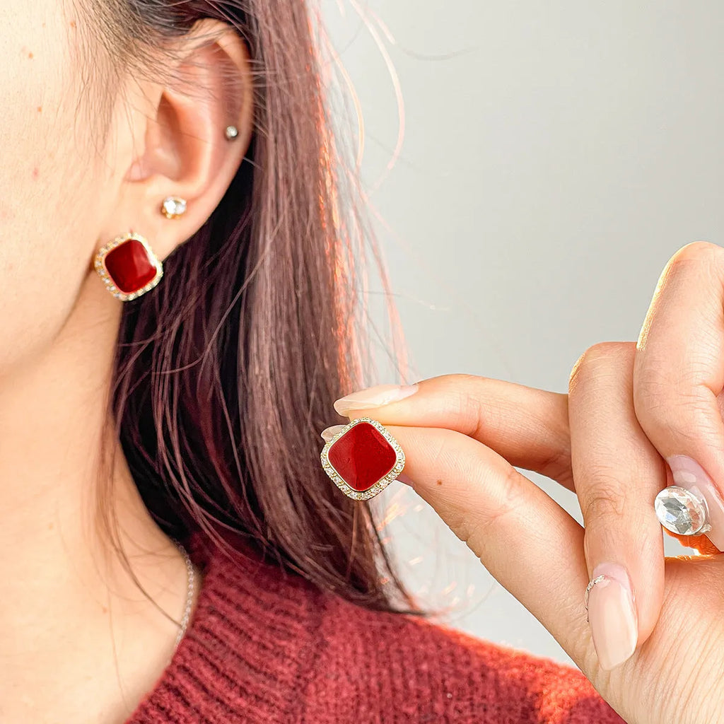 Red square-shaped alloy earrings for women with geometric design and Seiko-treated finish.