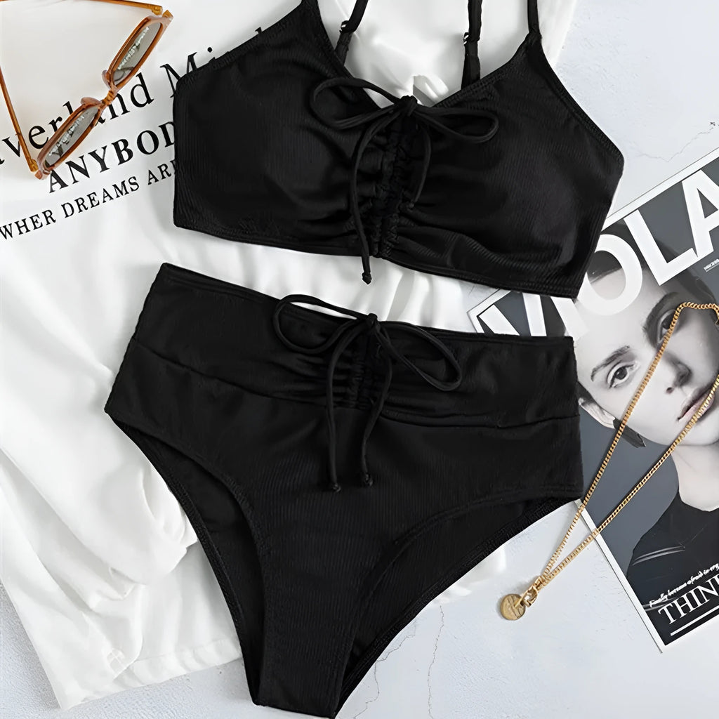 Black women's high-waisted bikini with sling split shorts and sleeveless top