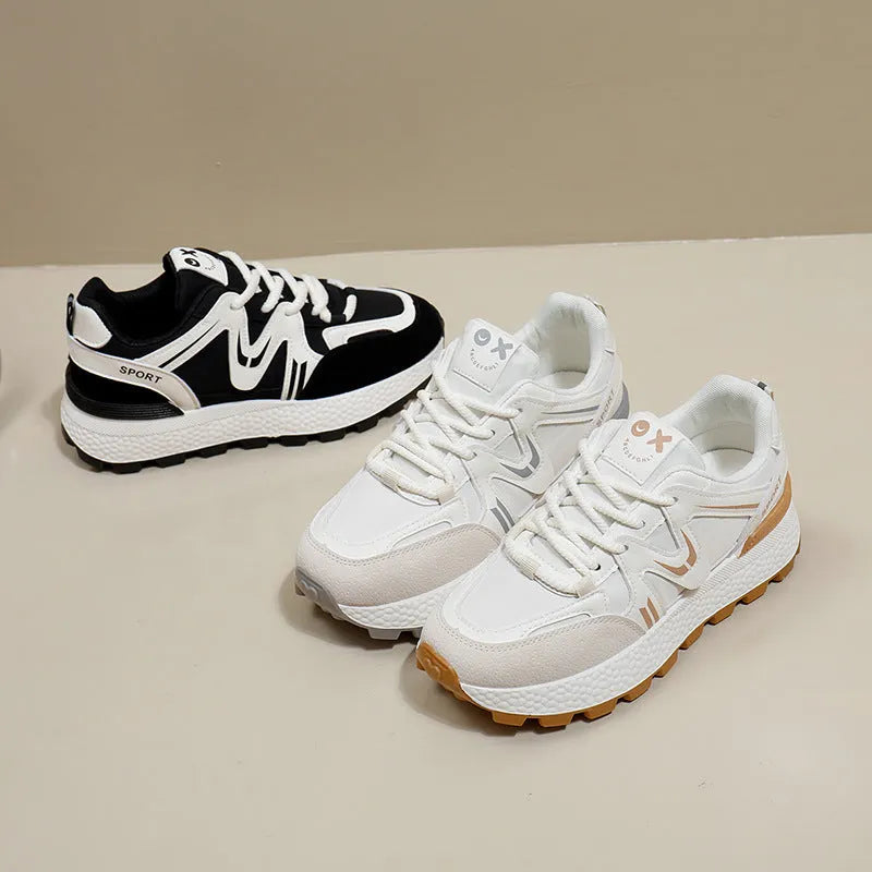 Women's black platform casual lace-up trainers with a round toe and flat heel on a white background.