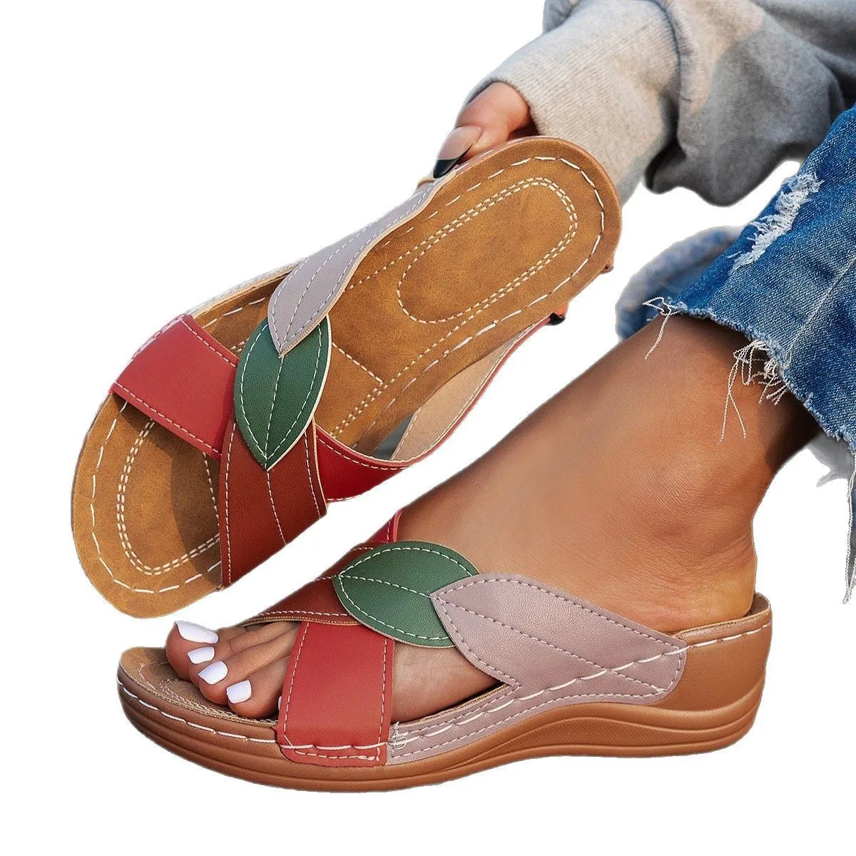 Black women's peep-toe slippers with a cross-strap design and a thick sole.