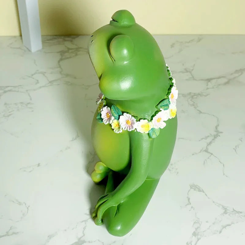European style Magic Yoga Frog plastic resin ornament in RDW123 colour on a tabletop.
