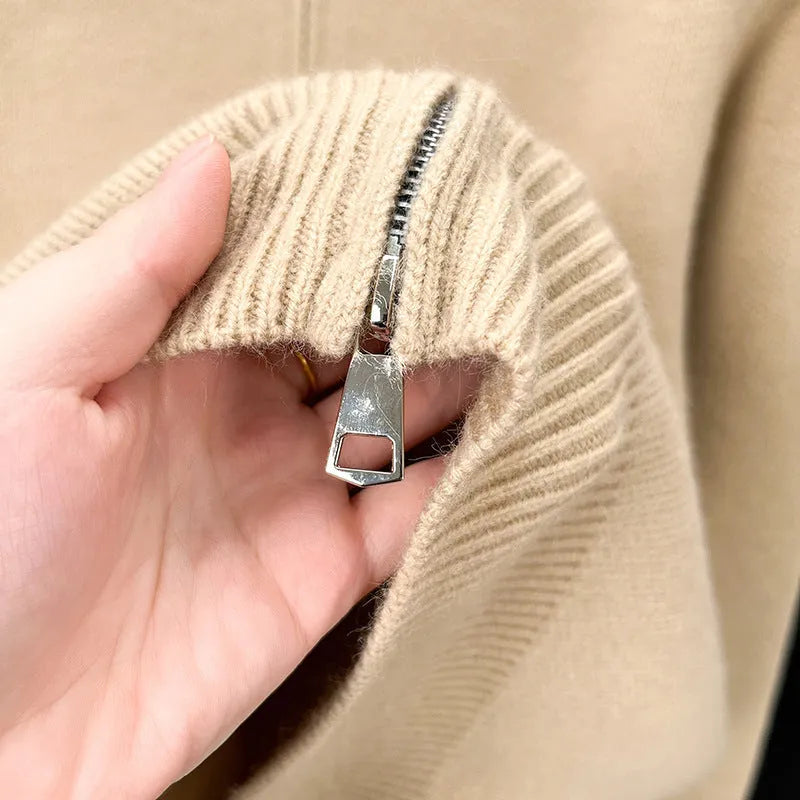 Men's black high collar zip-up knitted cardigan on a hanger, loose fit.