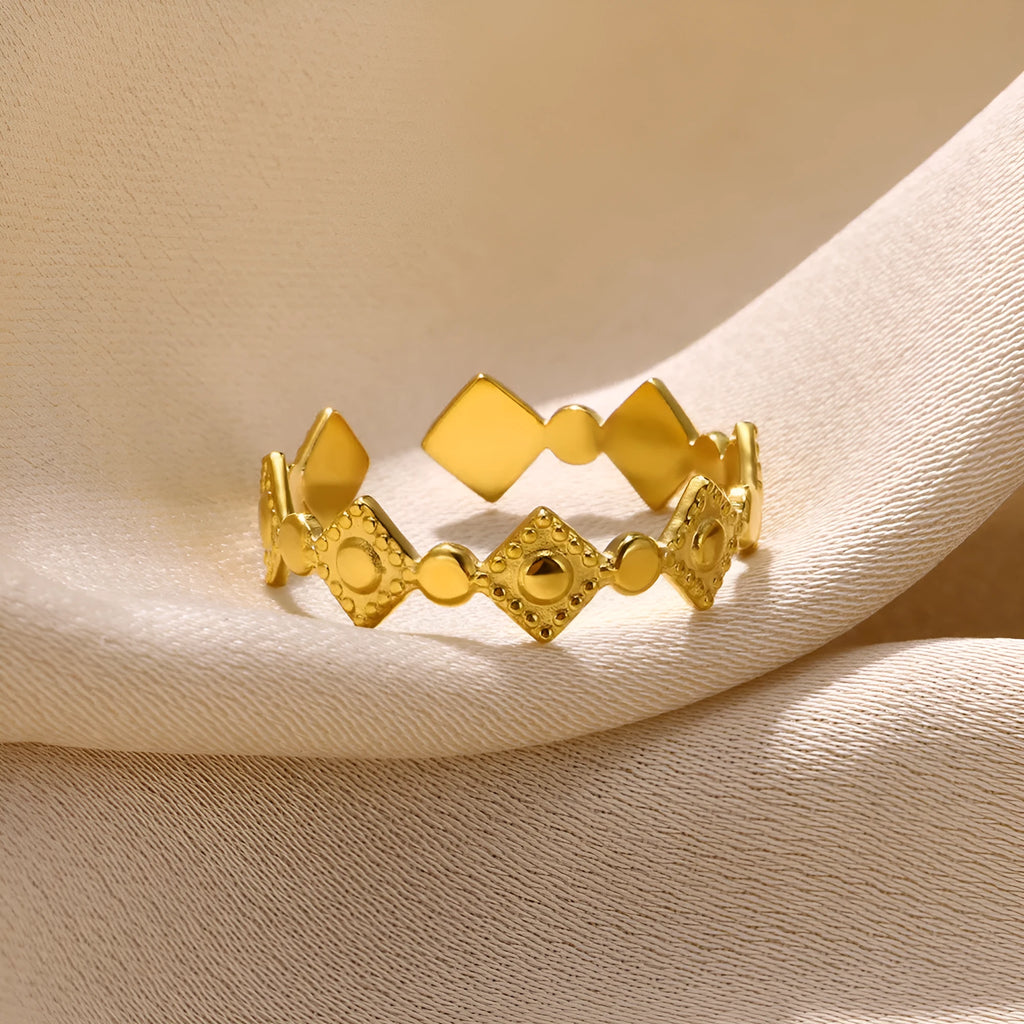 Geometric gold diamond titanium steel women's ring showing adjustable free-size band design