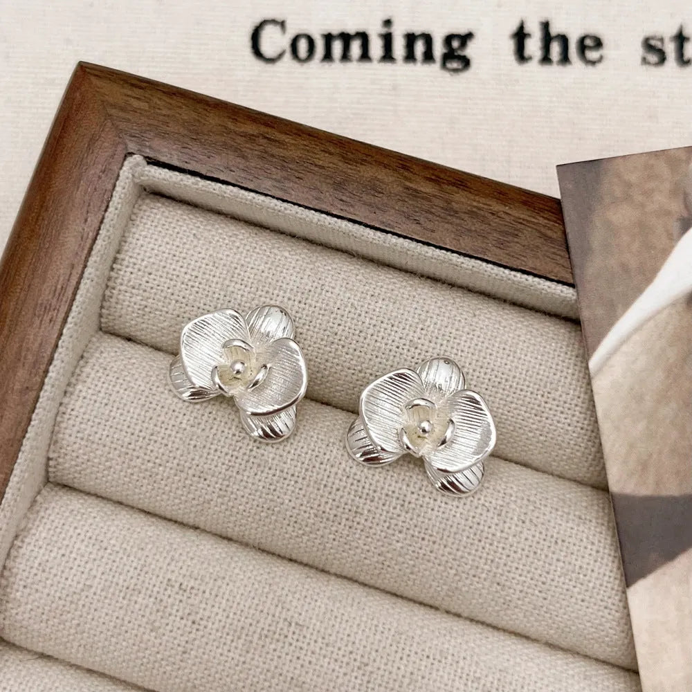 Copper flower earrings with electroplated gold or silver finish and retro petal design