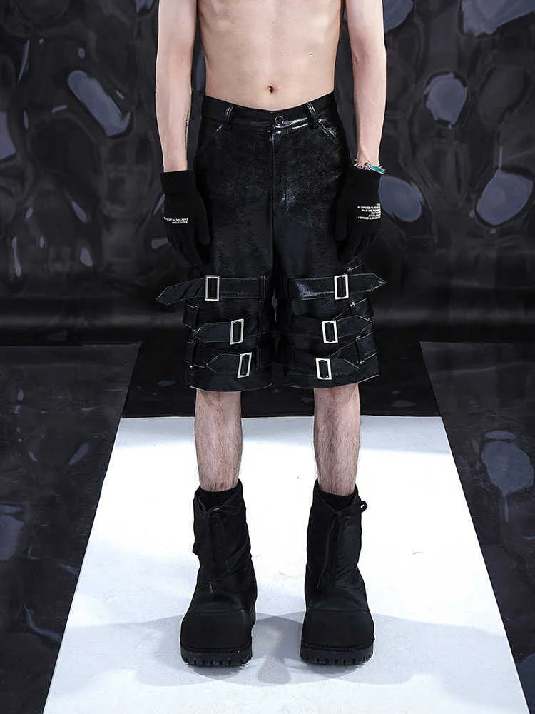 Men's black PU leather cropped shorts with medium-low waist design on hanger