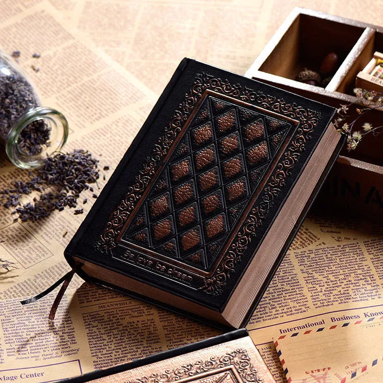 Embossed faux leather notepad showing three-dimensional cover design in bronze and black gold colour options
