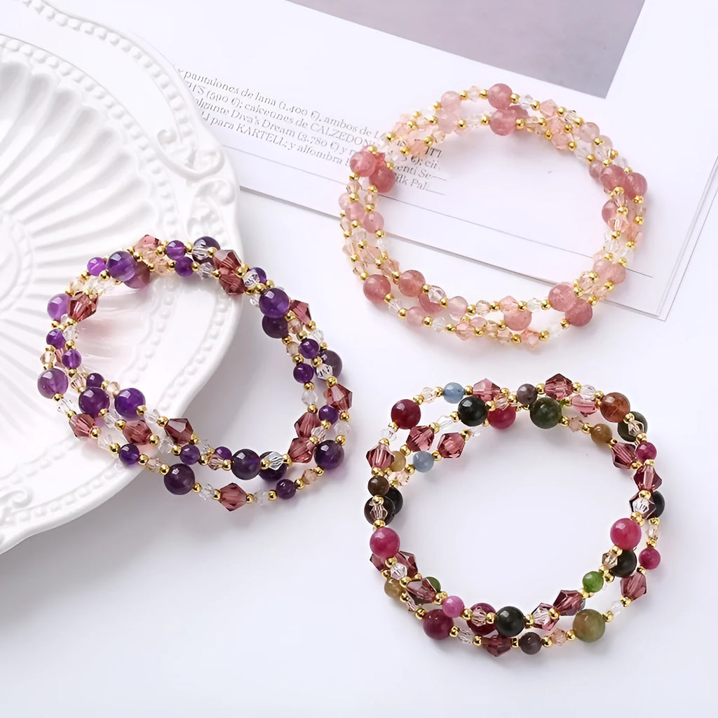 Close-up of a women's adjustable three-ring crystal bracelet in a choice of colours on a wrist.