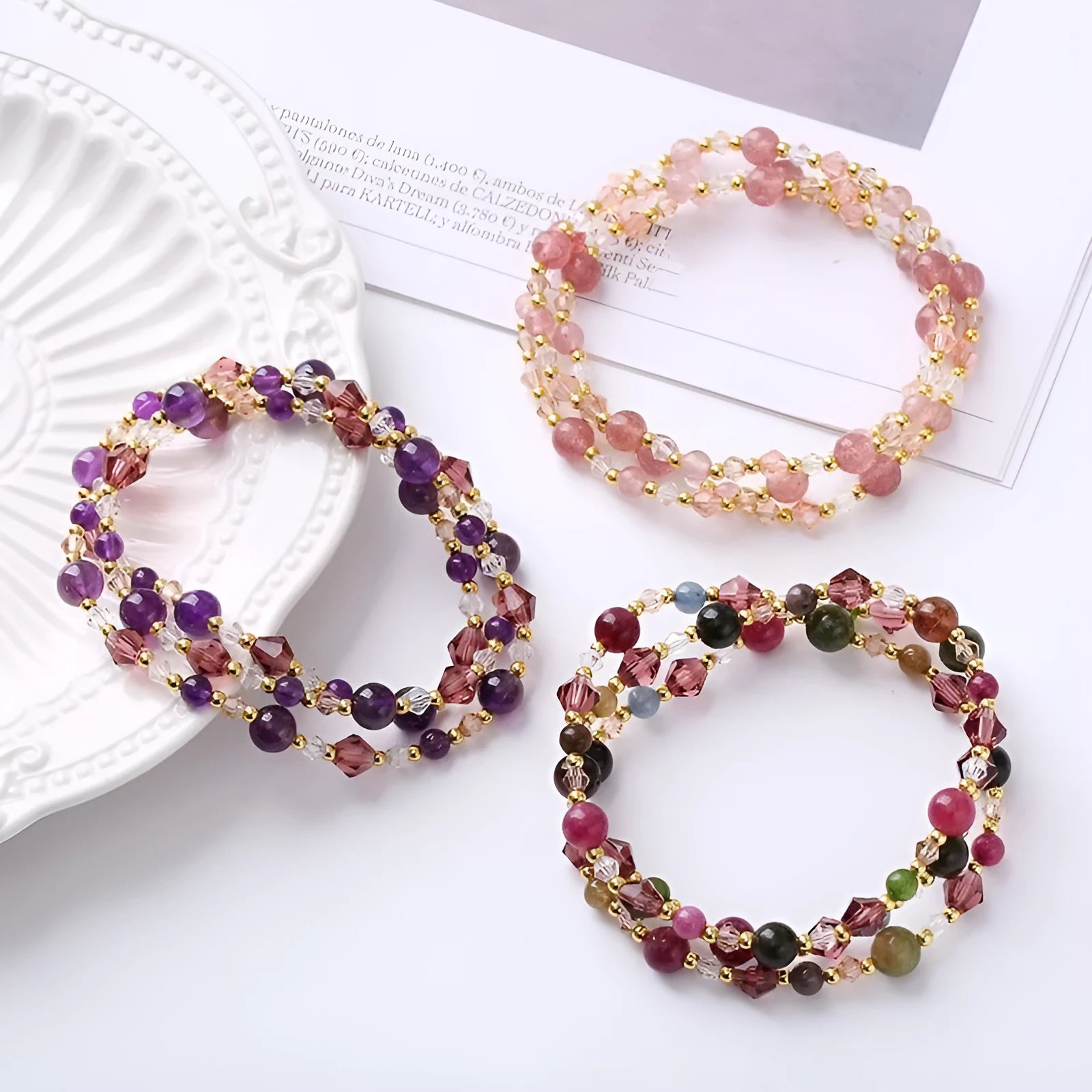 Close-up of a women's adjustable three-ring crystal bracelet in a choice of colours on a wrist.