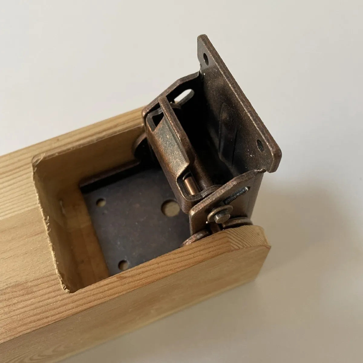 Furniture folding hinge with adjustable angle mechanism in various electroplated finishes including black bronze and nickel silver.