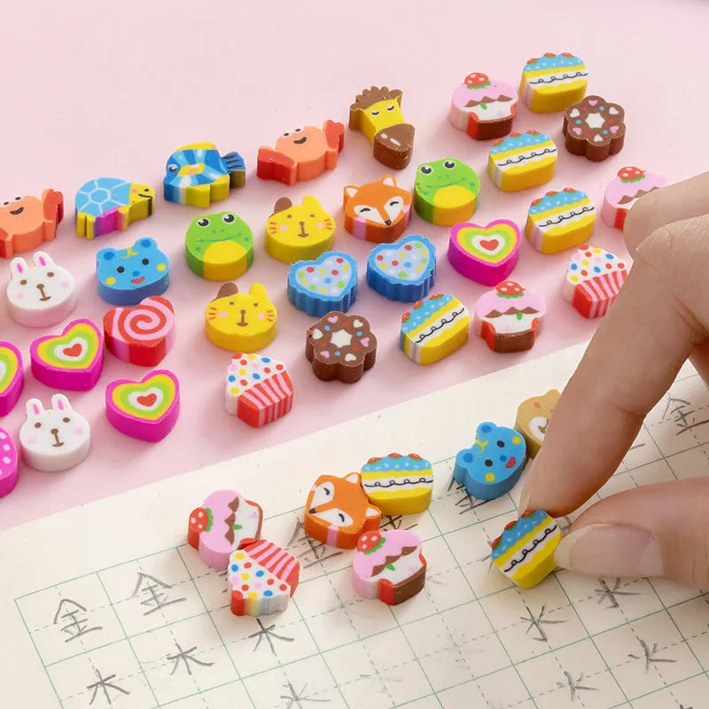 Assortment of 50 colourful miniature cartoon erasers including fruit, animal and theme designs.