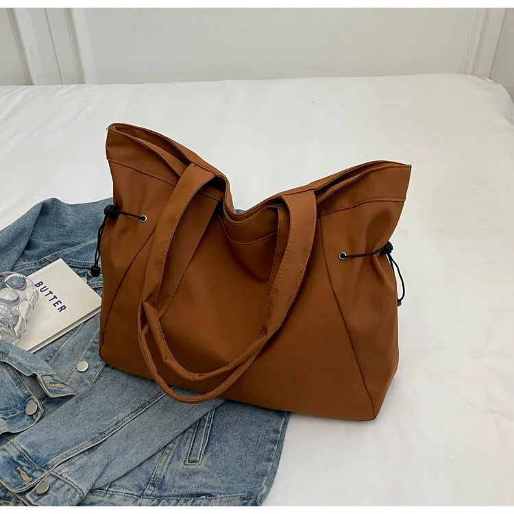 Soft foldable Oxford cloth commuter shoulder tote bag in street trend style.