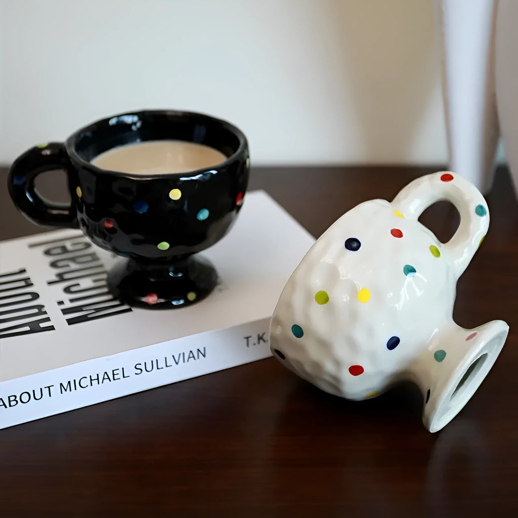 A hand-pinched irregular shaped ceramic mug in a solid colour, shown on a plain background.