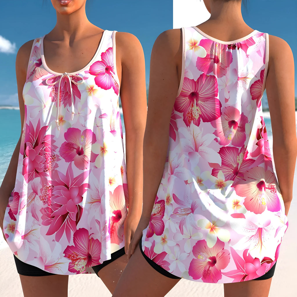 Pink printed plus size tankini swimsuit with high waist briefs on a mannequin