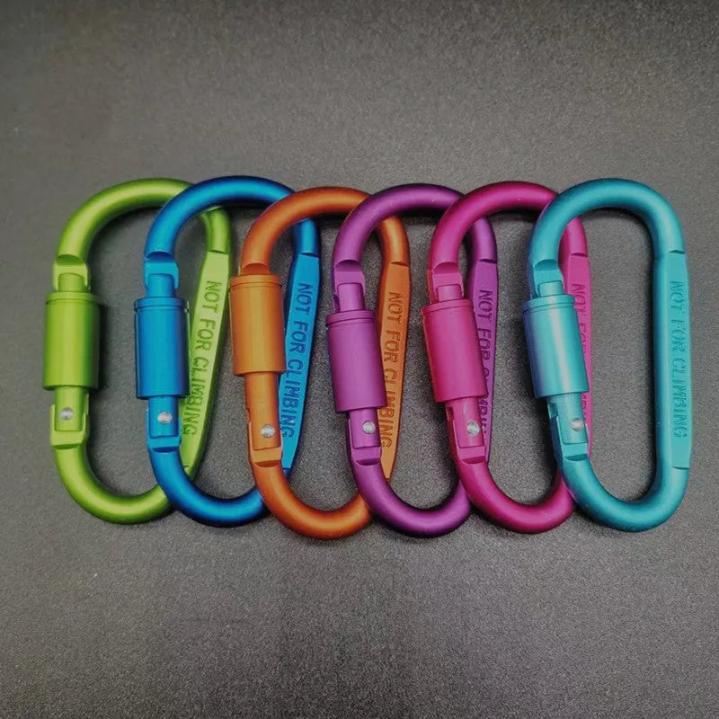 D-type aluminium locking climbing carabiner with screwgate, shown in a bright colour on a grey background.