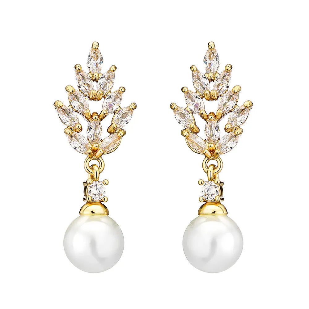 Geometric flower shaped earrings with micro inlaid zircon stones and pearl accents on a gold plated background.