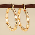 Geometric women's earrings with ring ear clip design in golden copper material