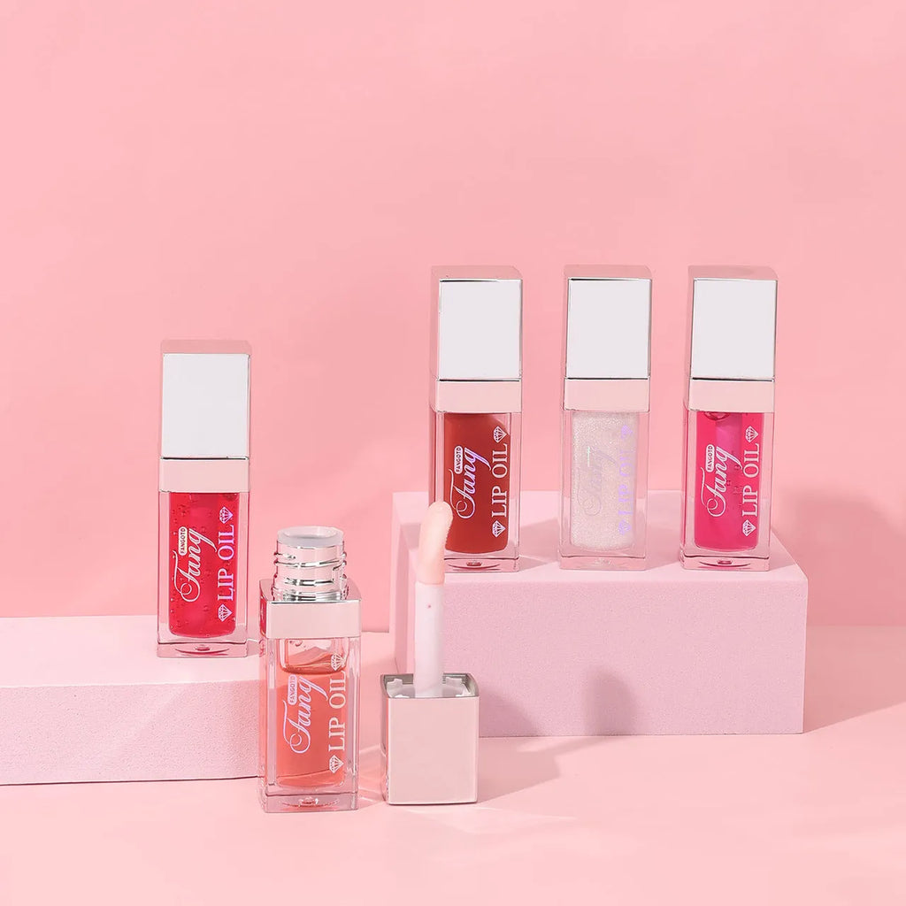 Five colour options of bright lip gloss mint lipstick with lip essence oil applicator