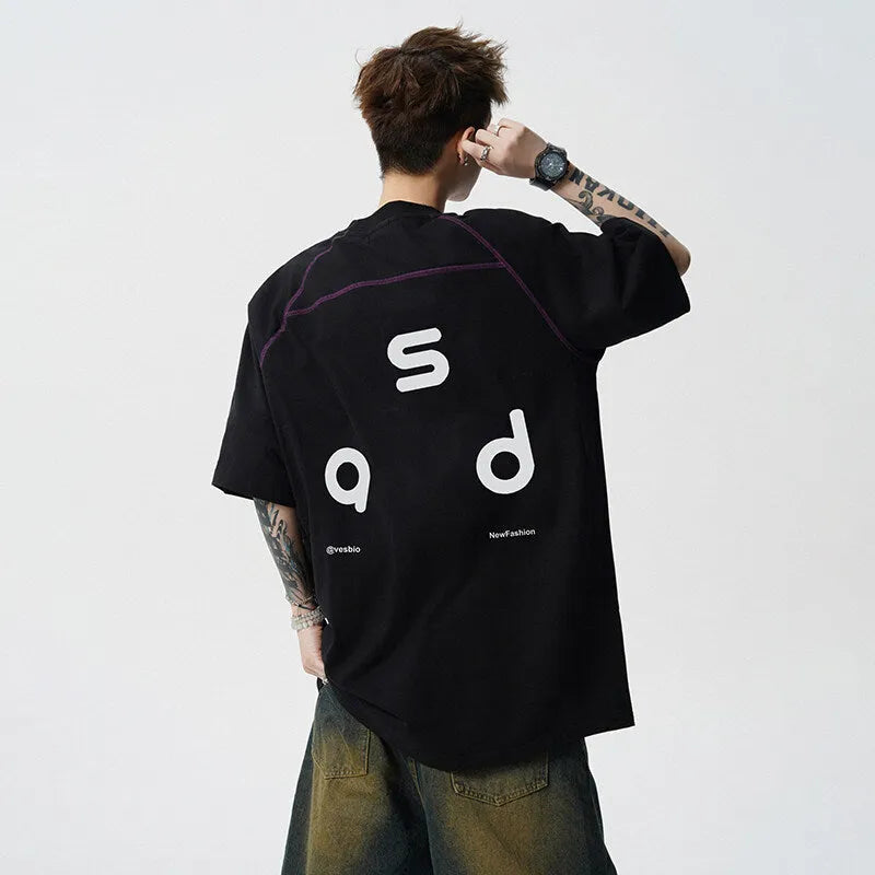 Men's loose fit cotton short-sleeve T-shirt with a printed letter design, shown in available colours.