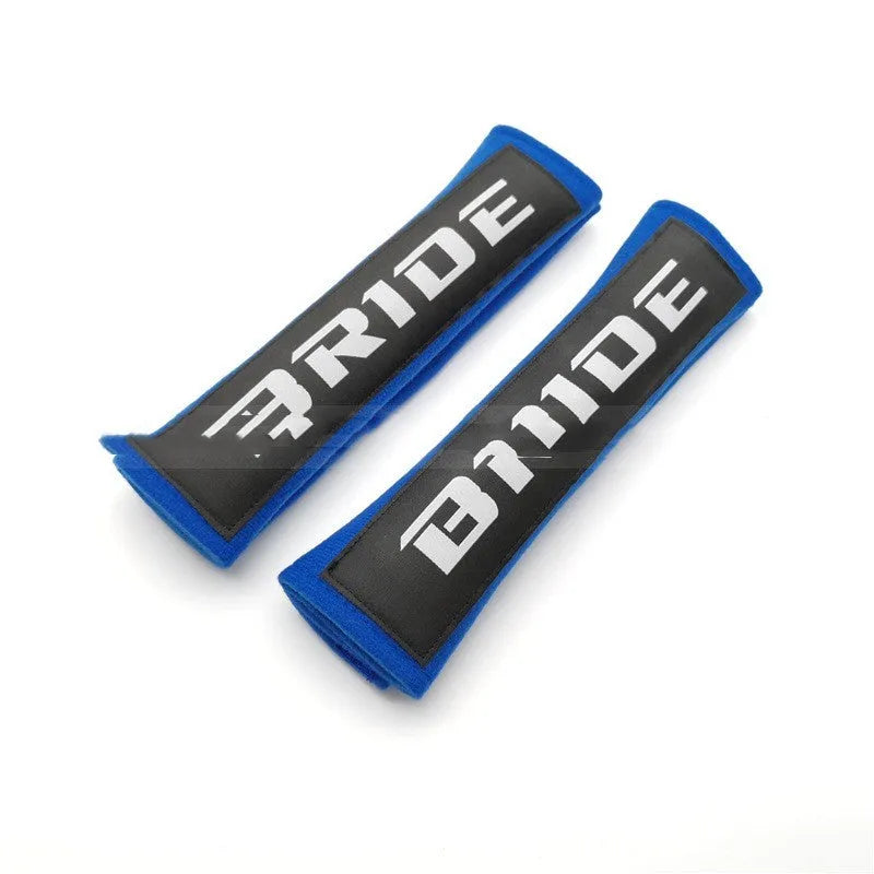 Car seatbelt shoulder pads with embroidery detail in black, blue, and red colour options
