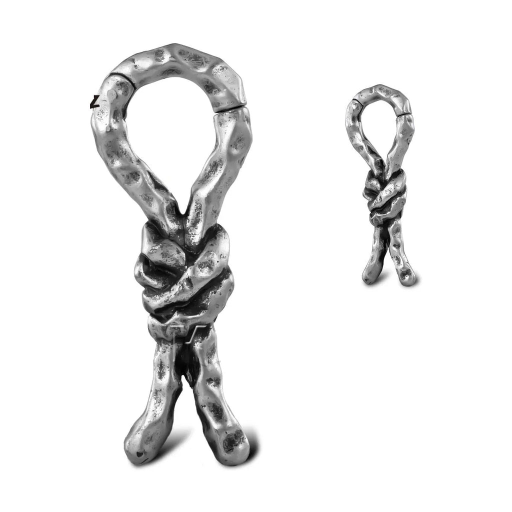 Close-up of copper retro earrings with a bending design for cartilage piercing.