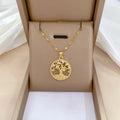 Gold-plated cross necklace with rhinestone lucky tree pendant and mother pearl detail on adjustable 41-50cm chain