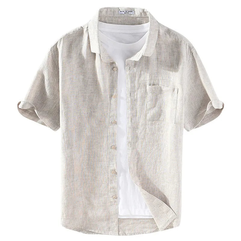 Men's light brown linen shirt with a square collar and short sleeves, shown on a hanger.