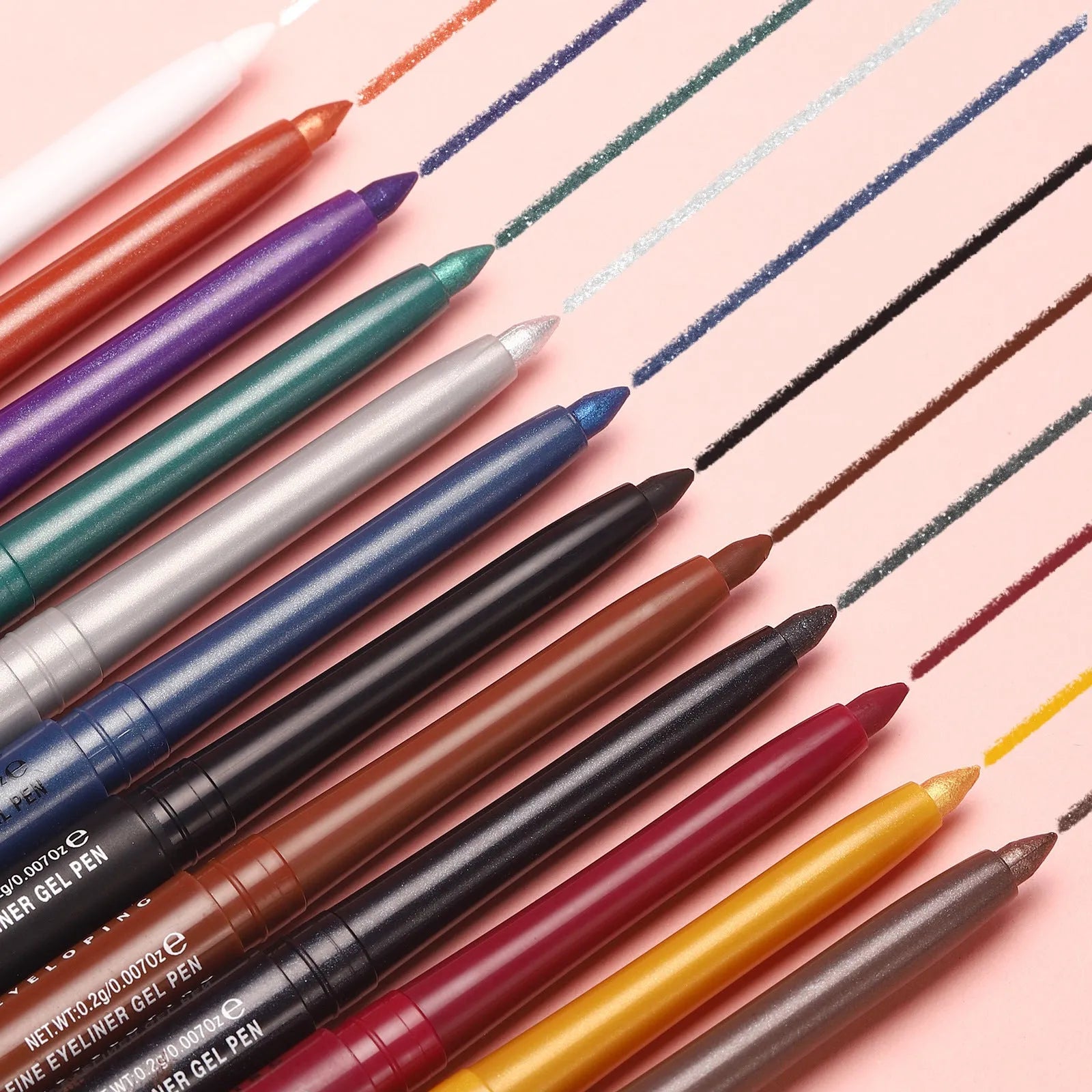 Set of 12 colourful gel glitter eyeliner pencils with various shades on white background