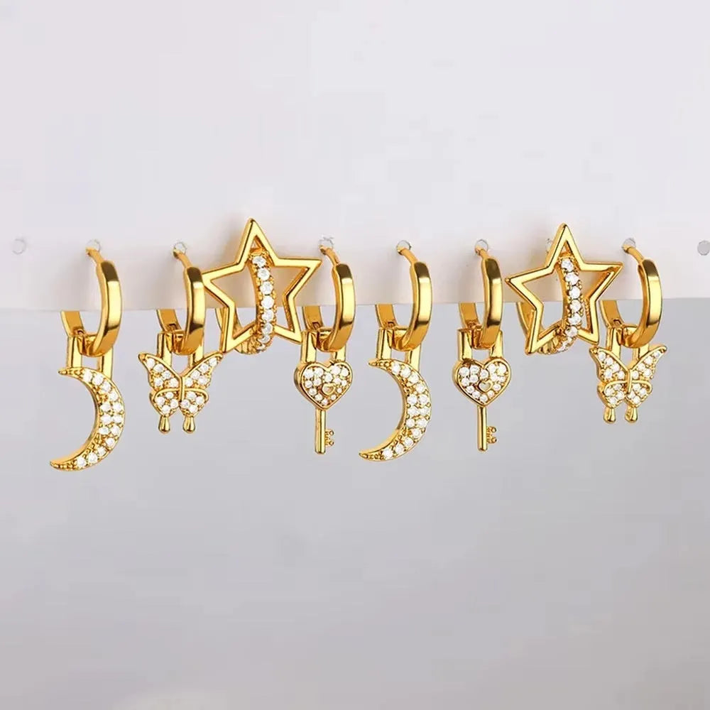 Women's geometric butterfly-shaped copper earrings with heart and star details in assorted colours.