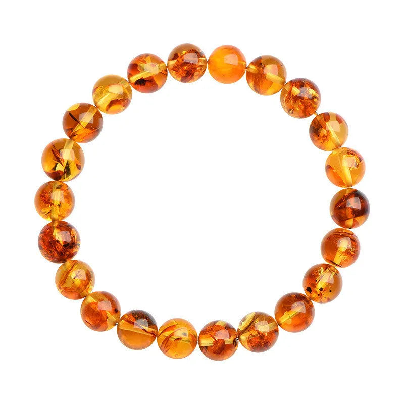 Natural yellow piebald amber bracelet with polished geometric beads on a string