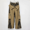 Women's high waist straight leg jeans with leopard print detail on dark khaki denim