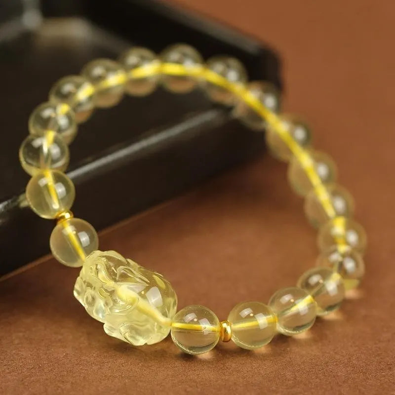 Yellow leather cord Citrine Pi Xiu bracelet with Chinese charm in 6mm, 8mm, or 10mm size.