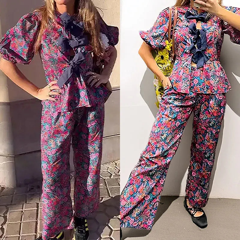 Floral printed two-piece trouser suit with puff sleeves and tie-neck detail in picture colour