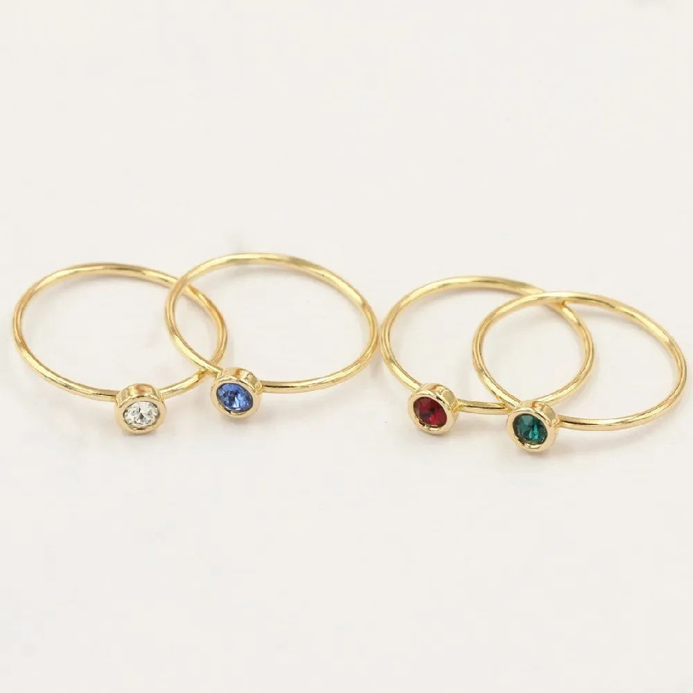 Women's knuckle ring with gilded GF setting and zircon stones on adjustable copper band