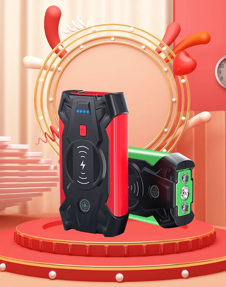 Red portable car emergency jump starter with digital display and thick clamps for 12V vehicle battery rescue