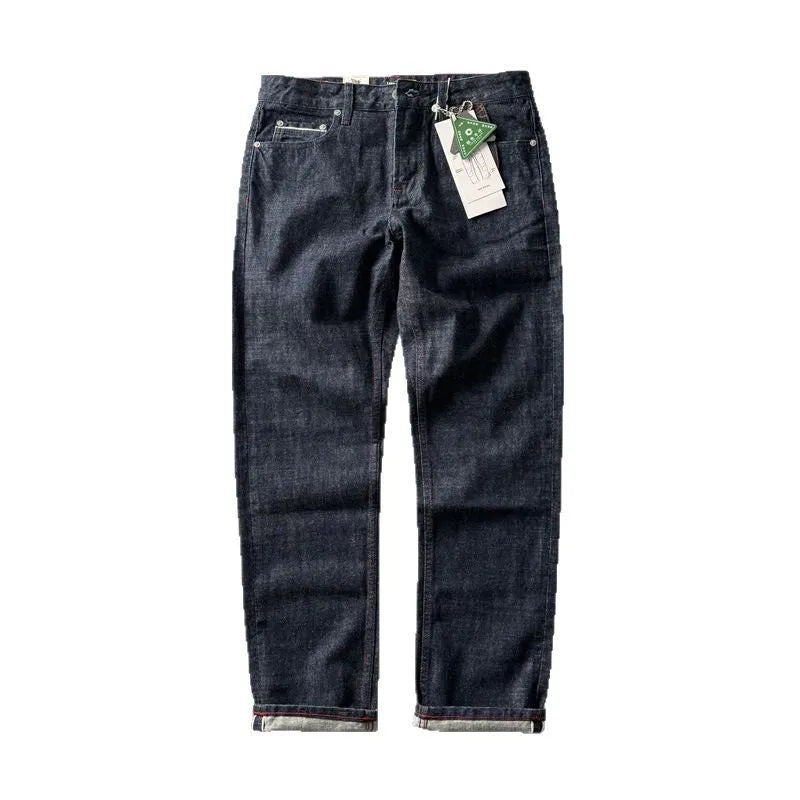Men's straight leg denim trousers in a primary colour, showing the mid waist fit and long leg.