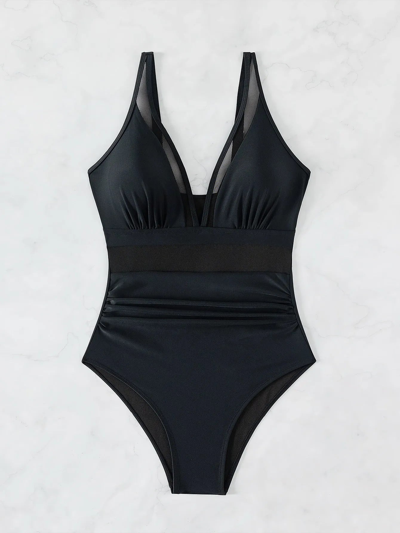 Black women's halter neck one-piece swimsuit with mesh detailing and briefs style cut